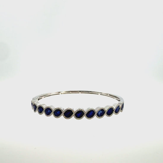 360 video of The Midnight Oval Bangle, 7.00ct Sapphire & Diamond, 14K White Gold by Benji Designs