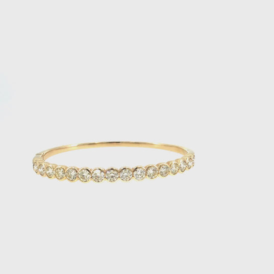 360 video of The Sunburst Bezel Bangle, 6.55ct Diamond, 14K Yellow Gold by Benji Designs