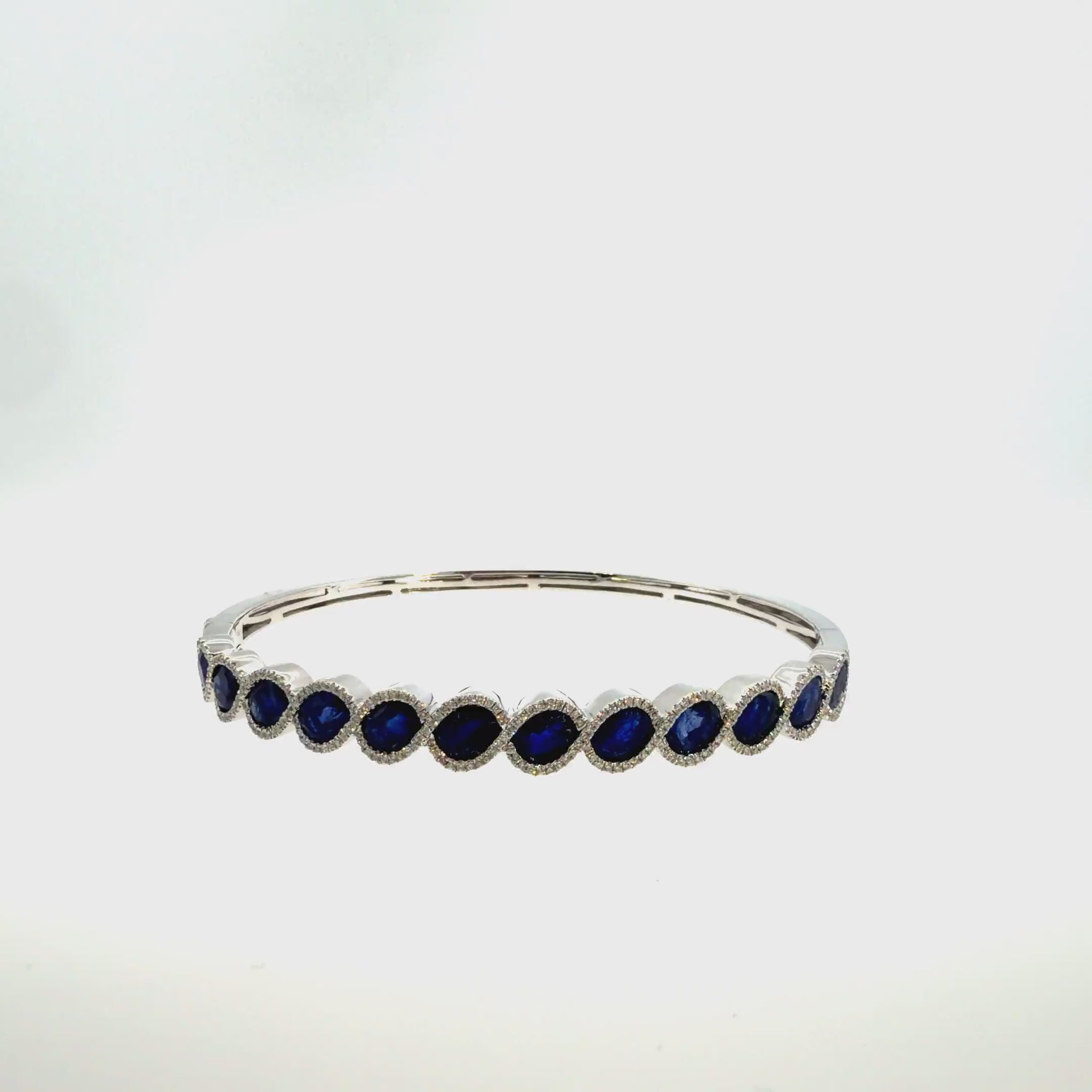 360 video of The Midnight Oval Bangle, 7.00ct Sapphire & Diamond, 14K White Gold by Benji Designs